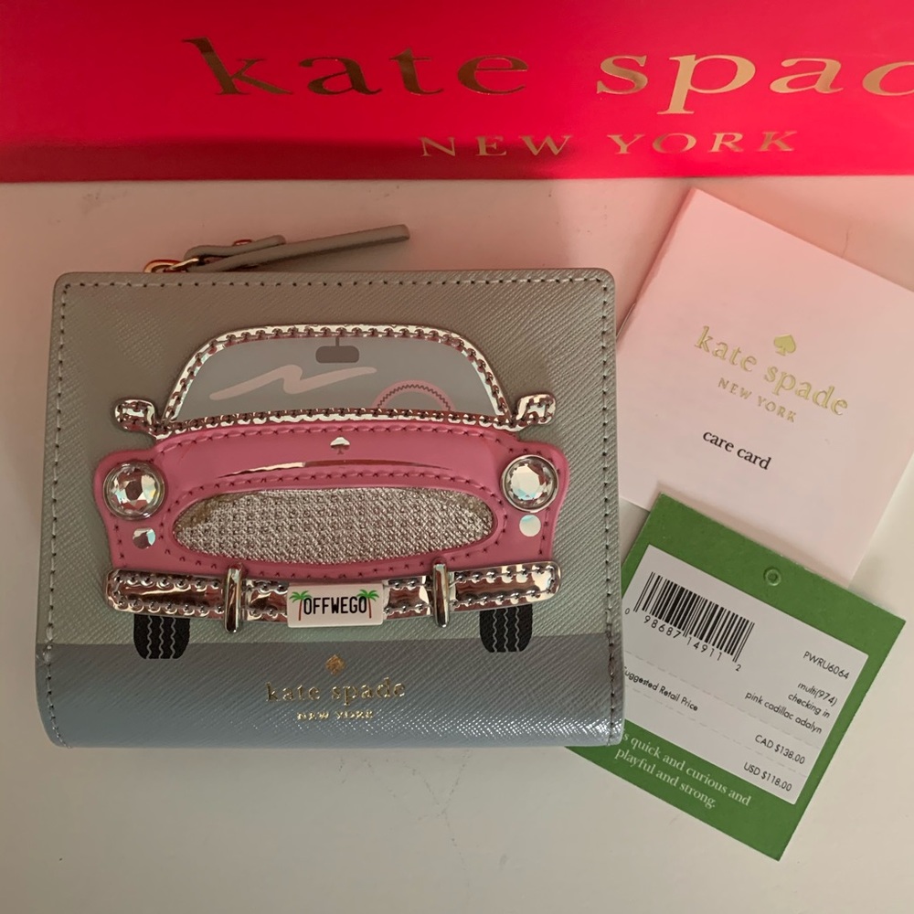 Authentic Kate Spade “Off We Go” leather wallet